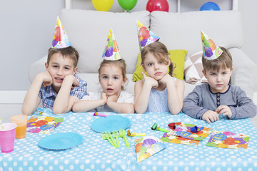 Happy group of children having fun at birthday party. Happy birthday