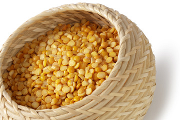 Dry yellow split peas isolated on white.