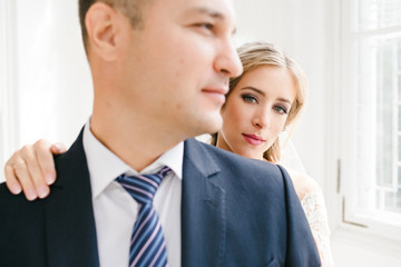 The bride embracing her groom