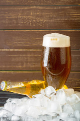 Bottles of cold and fresh beer with ice