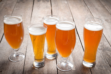 glass beer on wood background