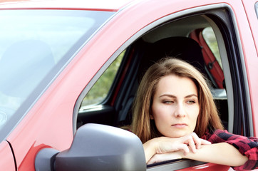 Naklejka na ściany i meble Young woman in car