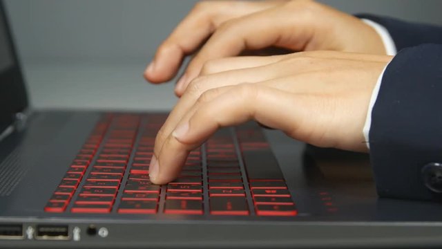 Business women's hands typing on computer keyboard