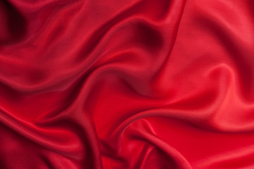 Fototapeta na wymiar Red cloth waves background texture