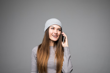 Young beautiful relaxed woman talking on mobile phone and smiling