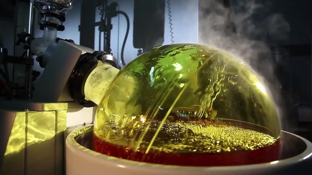 a development liquid in glass, chemical laboratory and a machine