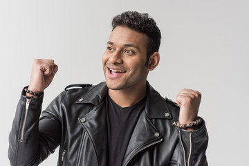 portrait of happy young african american man gesturing isolated on grey