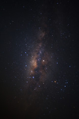 Fototapeta premium Milky way galaxy with stars and space dust in the universe, Long exposure photograph, with grain.