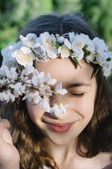 Obraz premium Attractive blond girl in forest dressed in communion