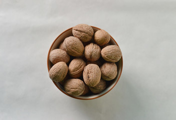 Nuts in the bowl on a white background