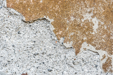 Grunge old cement plaster wall of the old house texture.