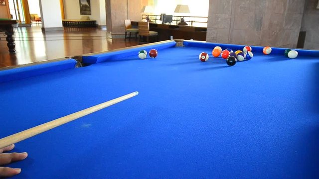 Playing billiard indoor