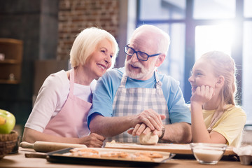 family kneading dough