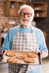 Senior man with cookies
