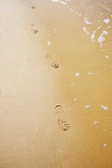 Fototapeta na wymiar boot footprints on sand beach