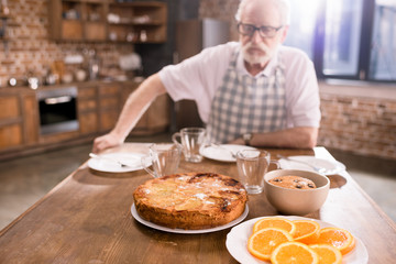 senior man sitting at table