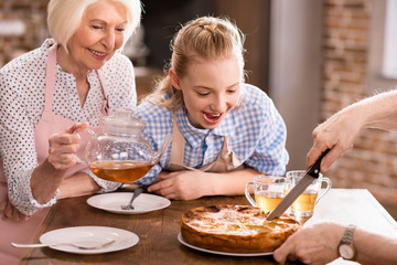 man cutting homemade pie