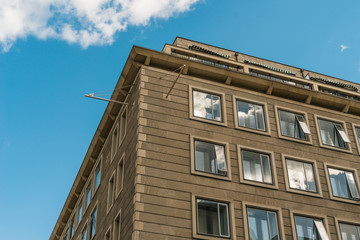 brown office building with big windows