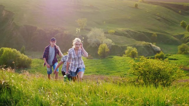 For several generations the family comes with a tree seedling, a shovel and a watering can. In picturesque green hills. The concept is to plant trees, volunteer work, a friendly family