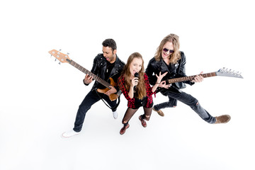 Obraz premium singer with microphone and musicians with electric guitars isolated on white, rock and roll band concept