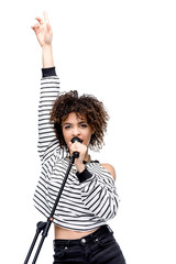 african american young woman singing with microphone isolated on white, female singer with...