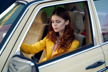 stylish woman driving a car