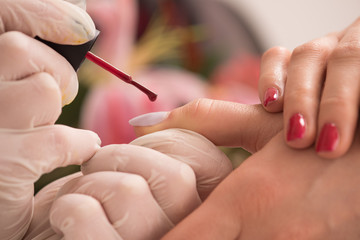 Woman hands receiving a manicure