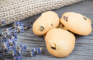 Homemade cookies with raisins on wooden table