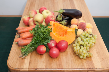 Fruit and vegetables on wooden table