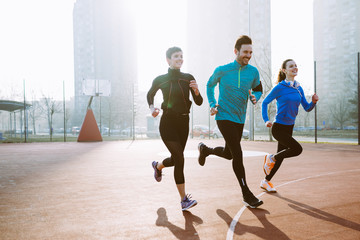 Friends fitness training together outdoors living active healthy lifestyle