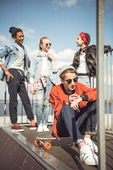Fototapeta premium teenagers spending time at skateboard park, teenagers having fun concept