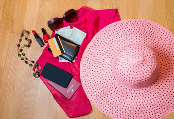 Travel accessories. Hat, wallet, passport, smart phone  prepared for the trip