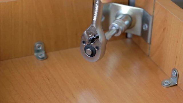 Furniture assembly with socket wrench