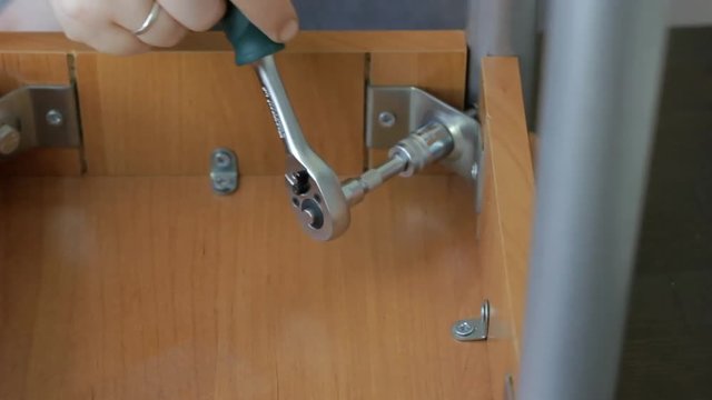 Furniture assembly with socket wrench