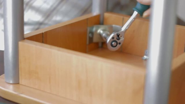 Furniture assembly with socket wrench