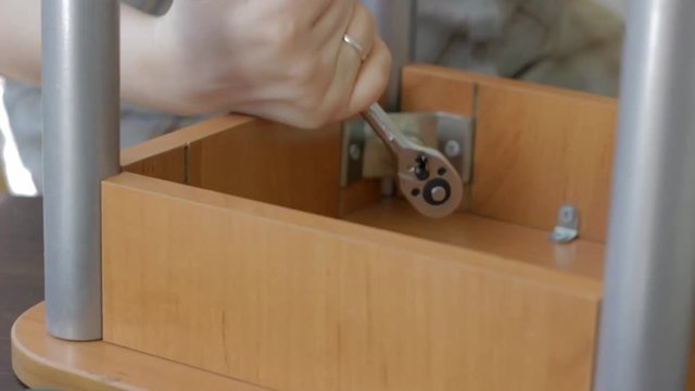 Furniture assembly with socket wrench
