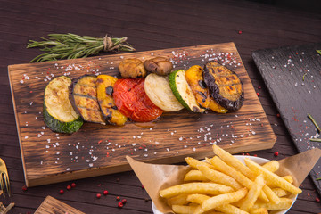Vegetables on coals, are served as a separate dish, or as a garnish for meat