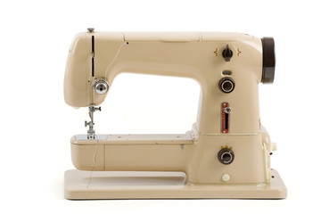 Old vintage sewing machine isolated on white