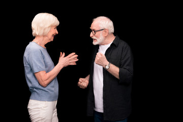 Senior couple gesturing