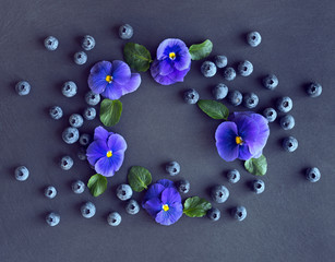 Midsummer decoration with blueberry and pansies.