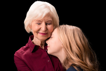 grandchild and grandmother hugging