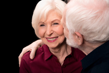 senior man kissing woman