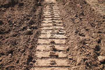 tractor track on sandy soil