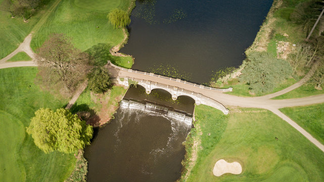 English countryside, bridge and weir; aerial view
