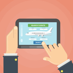 Flight ticket search. Hands typing on tablet for online booking.