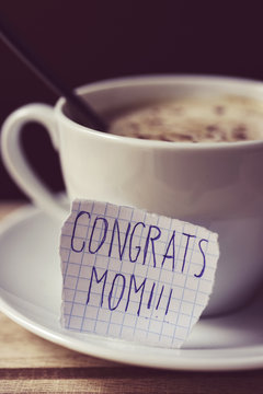 text congrats mom in a note