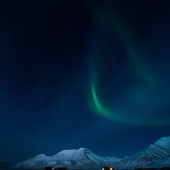Naklejka na ściany i meble the polar Northern aurora borealis lights in Norway Svalbard in the mountains