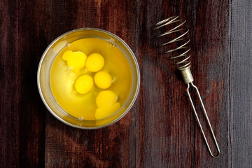 Mixing eggs to cook omlette using whisk