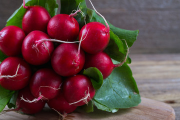 Farm fresh radish on rustic wooden board