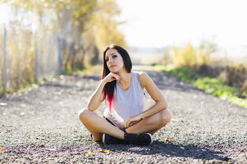Fitness woman sitting on the floor.